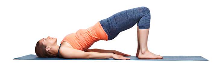 Pelvic floor exercise Woman on yoga mat doing pelvic floor exercise