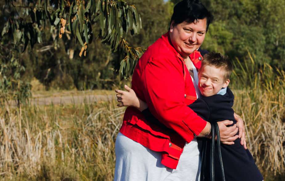Lady and boy hugging Lady and boy hugging and smiling