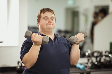 Man exercising Man exercising with dumbbells