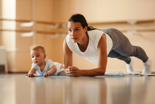 Incontinence kegel exercises Lady exercising with child sitting next to her
