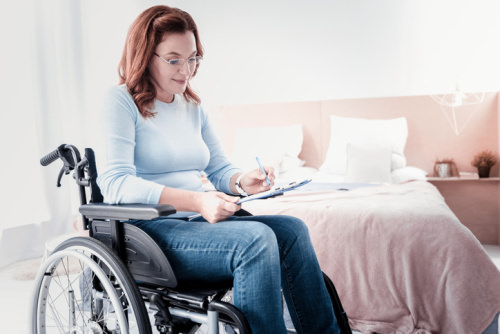 NDIS Planning Lady filling out paperwork