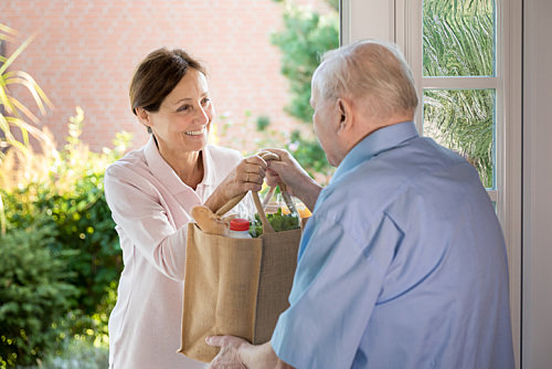 Disability Support Worker Delivering Groceries