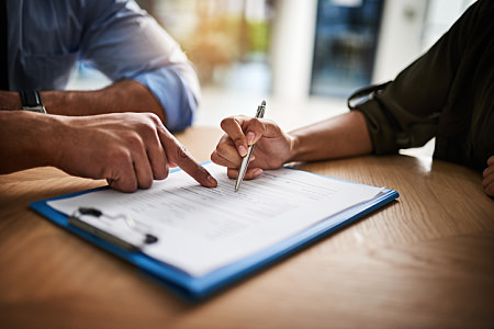 People Filling Out Checklist Form