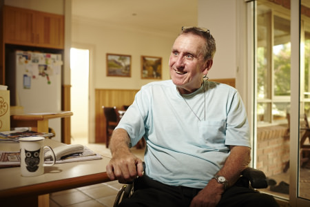 NDIS Man sitting in wheelchair smiling