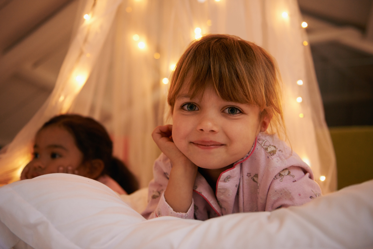 Having a sleepover with my best friend young toddler rests head at sleepover