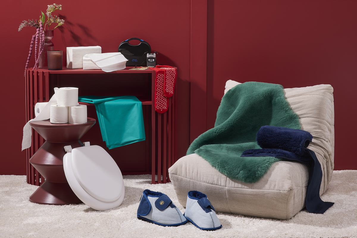 Daily living and mobility aids including a raised toilet seat, dressing aids, slippers and home comfort items.