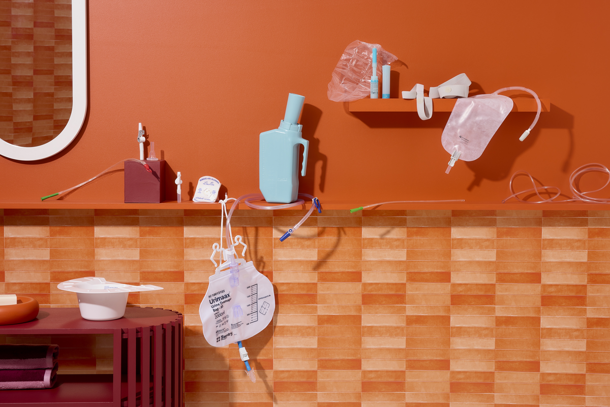Urology products including urinary drainage bags, catheters and accessories displayed on a shelf.